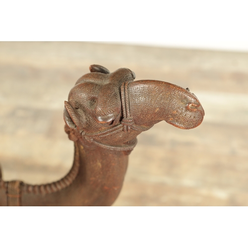 193 - A GOOD LATE 19TH CENTURY CARVED HARDWOOD ANGLO INDIAN OCCASIONAL TABLE modelled as a camel with leaf... 