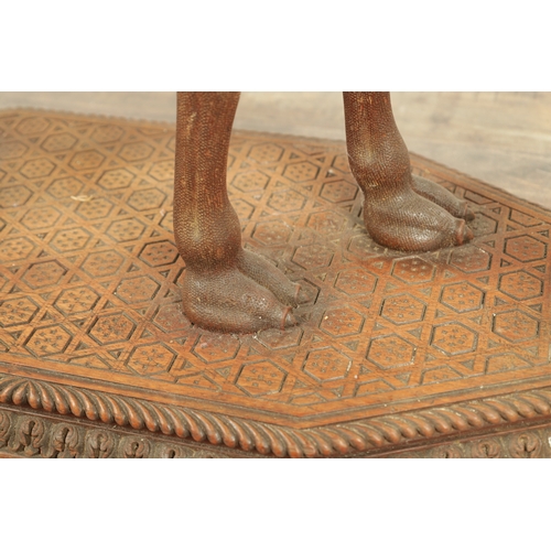 193 - A GOOD LATE 19TH CENTURY CARVED HARDWOOD ANGLO INDIAN OCCASIONAL TABLE modelled as a camel with leaf... 