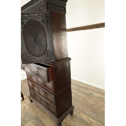 194 - AN EARLY 19TH CENTURY ANGLO INDIAN HARDWOOD SECRETAIRE CABINET ON CHEST with moulded cornice above a... 