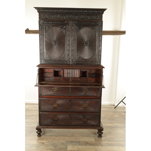 194 - AN EARLY 19TH CENTURY ANGLO INDIAN HARDWOOD SECRETAIRE CABINET ON CHEST with moulded cornice above a... 