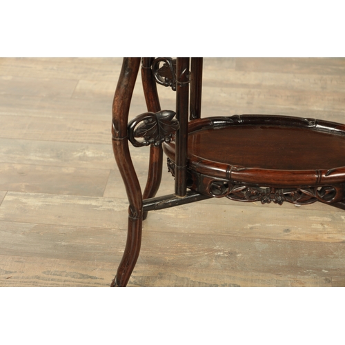 197 - A 19TH CENTURY CHINESE HARDWOOD OVAL SHAPED TWO-TIER TABLE with faux bamboo mouldings and supports d... 