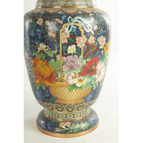 202 - A HIGHLY DECORATIVE AND COLOURFUL CHINESE CLOISONNE WARE HALL VASE with floral and geometric banded ... 