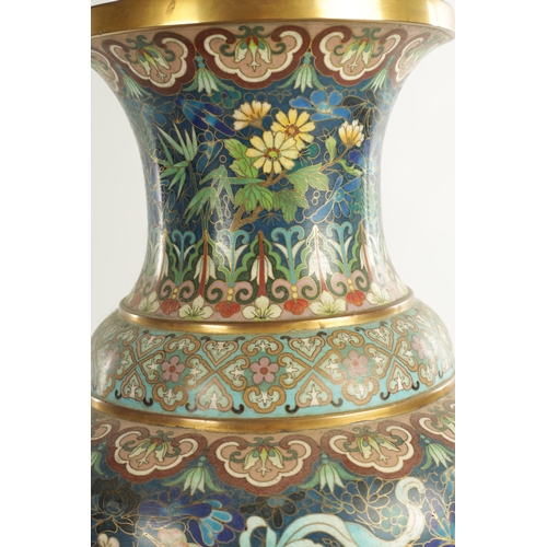 202 - A HIGHLY DECORATIVE AND COLOURFUL CHINESE CLOISONNE WARE HALL VASE with floral and geometric banded ... 