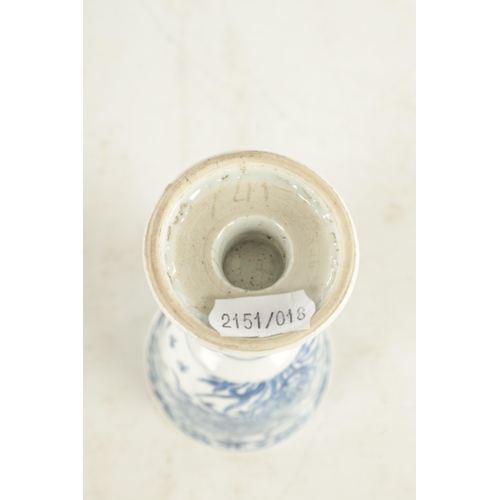 204 - A 19TH CENTURY CHINESE BLUE AND WHITE STEM CUP decorated with flowers and leaf work designs (15.5cm ... 