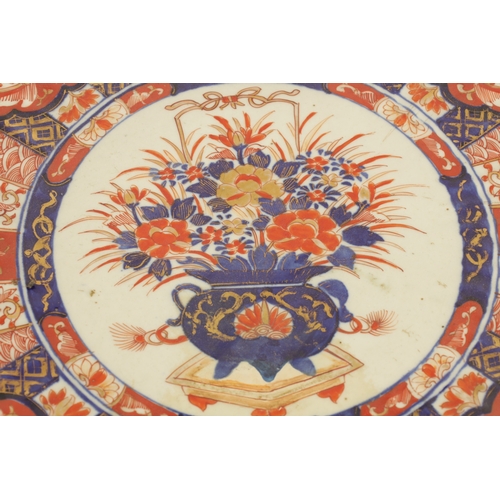 207 - A 19TH CENTURY IMARI CHARGER with a fluted border decorated with brightly coloured floral designs hi... 