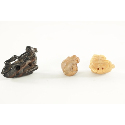 208 - TWO JAPANESE CARVED BOXWOOD NETSUKE AND A RESIN NETSUKE comprising of a water buffalo, monkey and a ... 