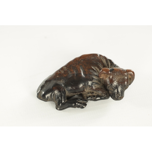 208 - TWO JAPANESE CARVED BOXWOOD NETSUKE AND A RESIN NETSUKE comprising of a water buffalo, monkey and a ... 