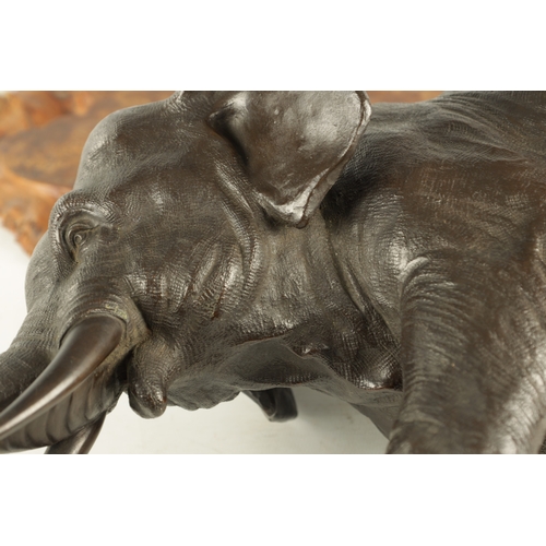 209 - A LATE 19TH CENTURY JAPANESE MEIJI PERIOD BRONZE SCULPTURE realistically modelled Elephant in a stam... 