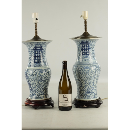 213 - A PAIR OF LATE 19TH CENTURY CHINESE BLUE AND WHITE VASE LAMPS with geometric designs and leaf work b... 