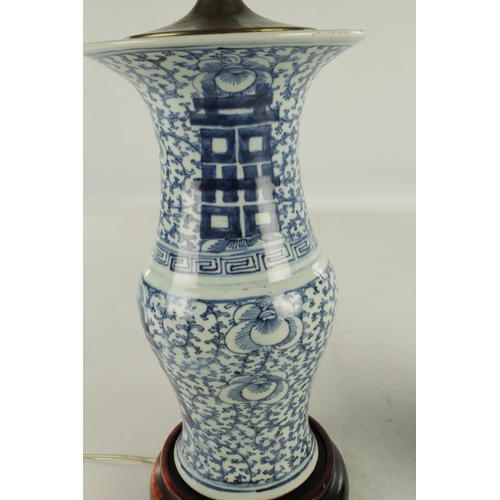 213 - A PAIR OF LATE 19TH CENTURY CHINESE BLUE AND WHITE VASE LAMPS with geometric designs and leaf work b... 