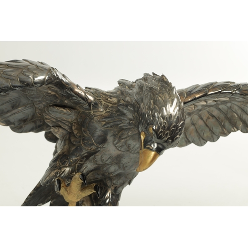 214 - A JAPANESE MEIJI PERIOD SILVERED BRONZE EAGLE SIGNED MASATSUNE realistically sculptured in a hoverin... 