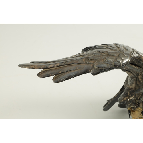 214 - A JAPANESE MEIJI PERIOD SILVERED BRONZE EAGLE SIGNED MASATSUNE realistically sculptured in a hoverin... 