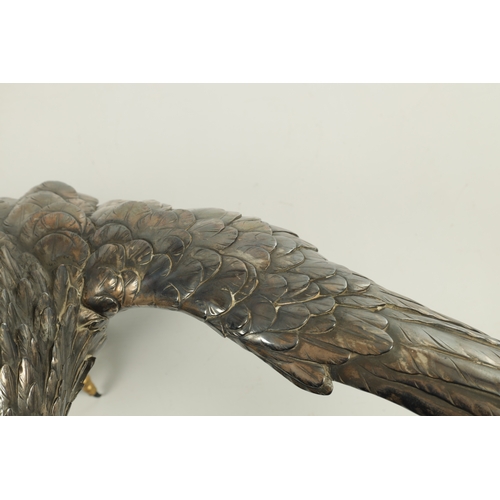 214 - A JAPANESE MEIJI PERIOD SILVERED BRONZE EAGLE SIGNED MASATSUNE realistically sculptured in a hoverin... 