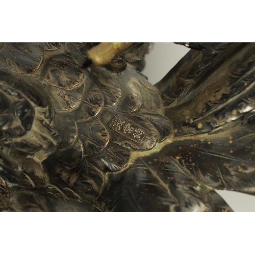 214 - A JAPANESE MEIJI PERIOD SILVERED BRONZE EAGLE SIGNED MASATSUNE realistically sculptured in a hoverin... 