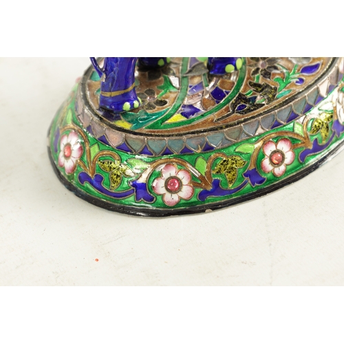 218 - A 20TH CENTURY INDIAN MEENAKARI SILVER AND COLOURED ENAMEL SCULPTURE of a standing elephant with how... 