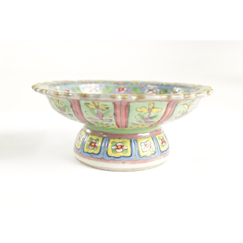 221 - A PAIR OF CHINESE FAMILLE VERTE STEM CUPS with scalloped edge rims, tapering stems decorated in brig... 