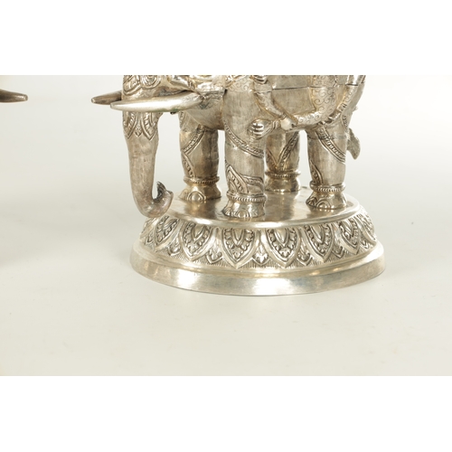 222 - A PAIR OF LATE 19TH CENTURY INDIAN SILVER SCULPTURES OF ELEPHANTS with relief moulded figures; raise... 