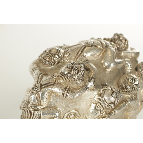 222 - A PAIR OF LATE 19TH CENTURY INDIAN SILVER SCULPTURES OF ELEPHANTS with relief moulded figures; raise... 