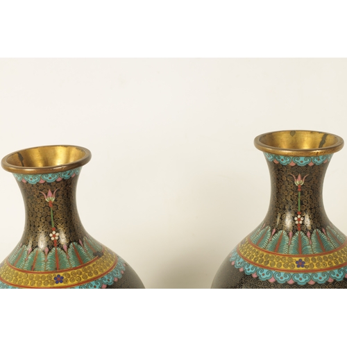 224 - A PAIR OF CHINESE CLOISONNE ENAMEL BULBOUS VASES WITH FLARED NECKS the bodies colourfully decorated ... 