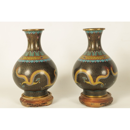 224 - A PAIR OF CHINESE CLOISONNE ENAMEL BULBOUS VASES WITH FLARED NECKS the bodies colourfully decorated ... 