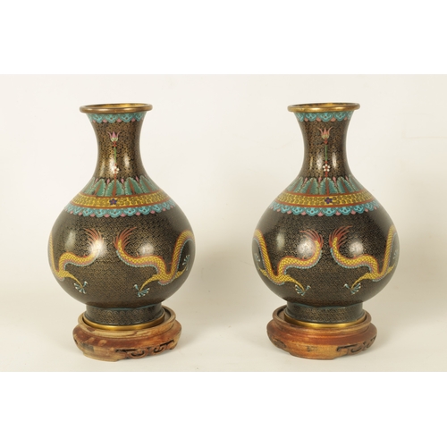 224 - A PAIR OF CHINESE CLOISONNE ENAMEL BULBOUS VASES WITH FLARED NECKS the bodies colourfully decorated ... 