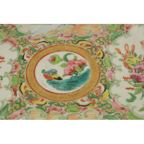 228 - TWO 19TH CENTURY FAMILLE ROSE CANTONESE PLATES decorated with panels of figures and birds amongst fl... 