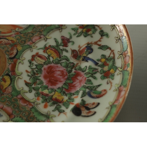 228 - TWO 19TH CENTURY FAMILLE ROSE CANTONESE PLATES decorated with panels of figures and birds amongst fl... 