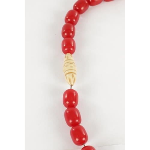 229 - A JAPANESE RED CORAL AND IVORY NECKLACE with pierced shaped pendant. Ivory Act 2018 Exemption Submis... 