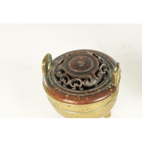 230 - AN 18TH/19TH CENTURY CHINESE BRONZE CENSER AND HARDWOOD COVER having pierced shaped carved cover on ... 