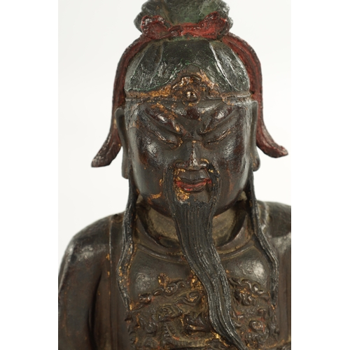 236 - A RARE AND LARGE 17TH CENTURY MING DYNASTY CHINESE POLYCHROME BRONZE IMMORTAL modelled in a seated p... 