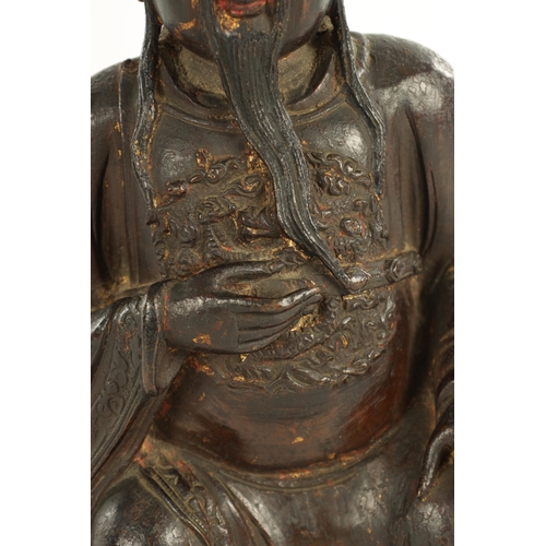 236 - A RARE AND LARGE 17TH CENTURY MING DYNASTY CHINESE POLYCHROME BRONZE IMMORTAL modelled in a seated p... 