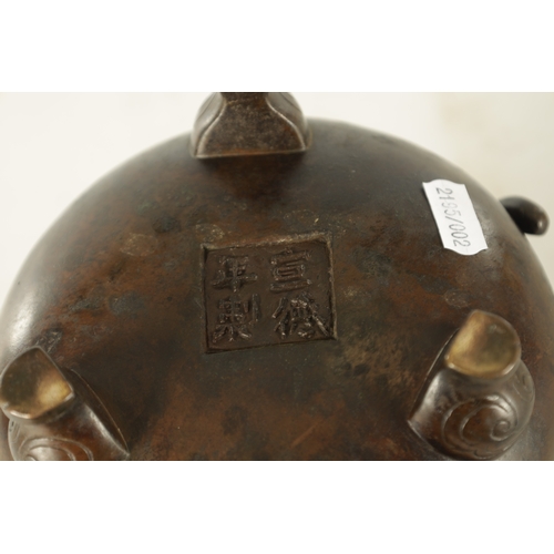 241 - A CHINESE PATINATED BRONZE CENSER WITH DRAGON HANDLES of squat bulbous form raised on shaped legs, i... 