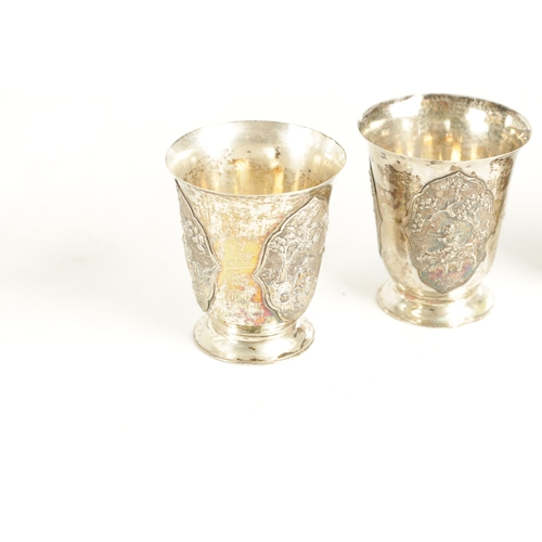 243 - AN EARLY 20TH CENTURY CHINESE SILVER METAL COCKTAIL SHAKER AND EIGHT SHOT GLASSES having panelled fi... 