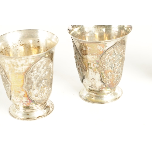 243 - AN EARLY 20TH CENTURY CHINESE SILVER METAL COCKTAIL SHAKER AND EIGHT SHOT GLASSES having panelled fi... 