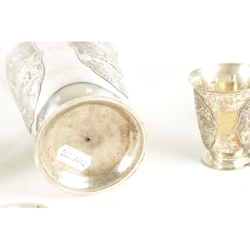 243 - AN EARLY 20TH CENTURY CHINESE SILVER METAL COCKTAIL SHAKER AND EIGHT SHOT GLASSES having panelled fi... 