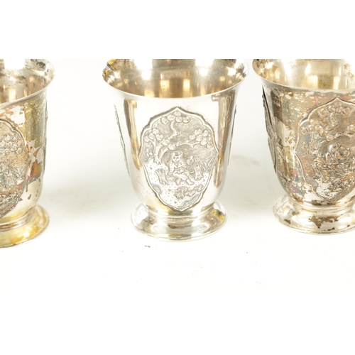 243 - AN EARLY 20TH CENTURY CHINESE SILVER METAL COCKTAIL SHAKER AND EIGHT SHOT GLASSES having panelled fi... 