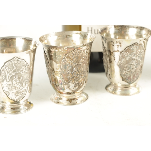 243 - AN EARLY 20TH CENTURY CHINESE SILVER METAL COCKTAIL SHAKER AND EIGHT SHOT GLASSES having panelled fi... 