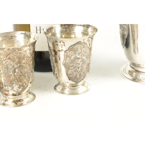 243 - AN EARLY 20TH CENTURY CHINESE SILVER METAL COCKTAIL SHAKER AND EIGHT SHOT GLASSES having panelled fi... 