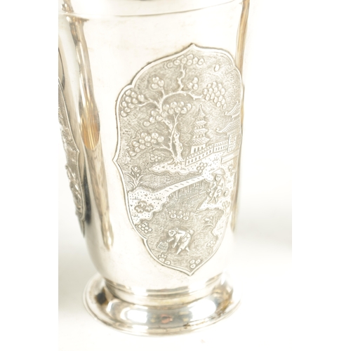 243 - AN EARLY 20TH CENTURY CHINESE SILVER METAL COCKTAIL SHAKER AND EIGHT SHOT GLASSES having panelled fi... 