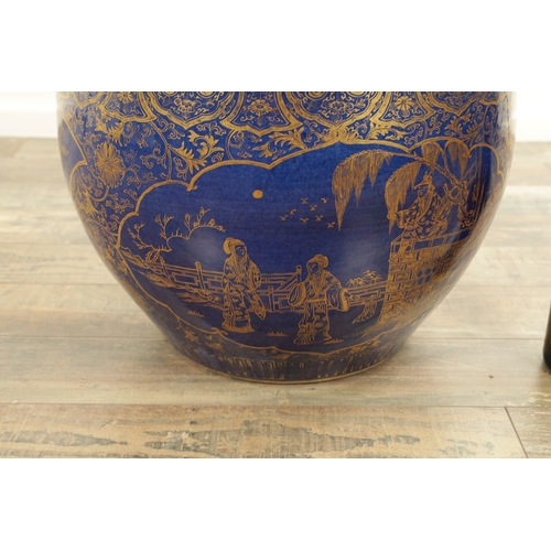 247 - A 19TH CENTURY CHINESE JARDINIERE OF LARGE SIZE on blue ground with panelled gilt decoration. (40cm ... 