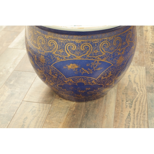 247 - A 19TH CENTURY CHINESE JARDINIERE OF LARGE SIZE on blue ground with panelled gilt decoration. (40cm ... 