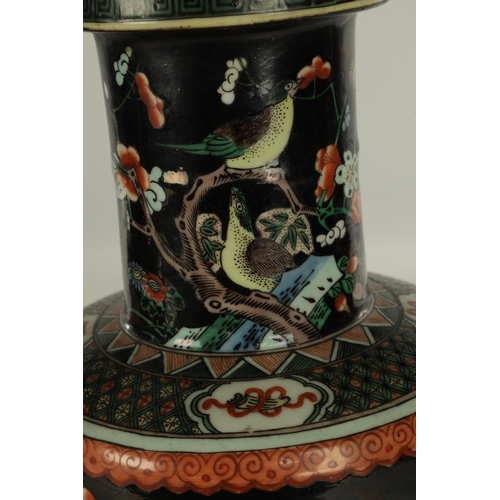 255 - A PAIR OF LATE 19TH CENTURY CHINESE FAMILLE NOIRE VASES decorated with birds amongst blossoming tree... 