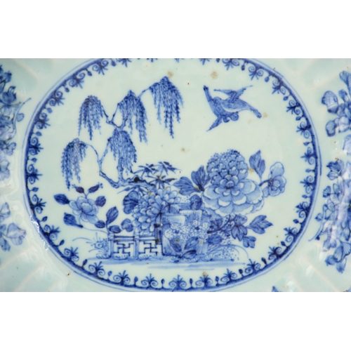 258 - AN 18TH CENTURY CHINESE PORCELAIN BLUE AND WHITE OVAL-SHAPED DISH with scalloped sides, decorated wi... 