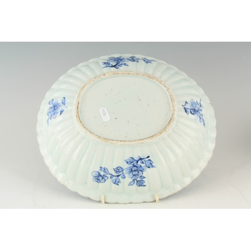 258 - AN 18TH CENTURY CHINESE PORCELAIN BLUE AND WHITE OVAL-SHAPED DISH with scalloped sides, decorated wi... 