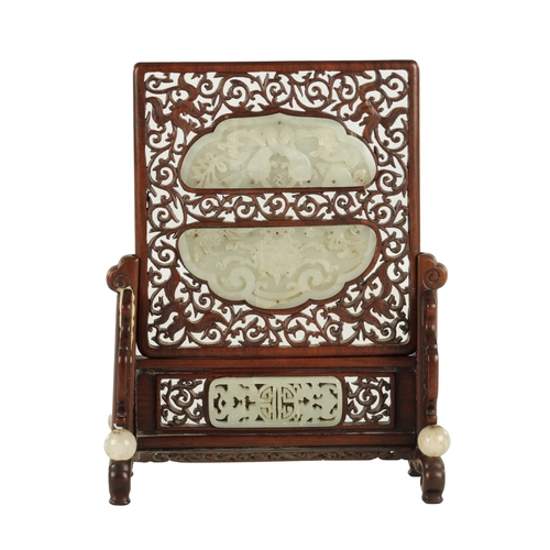 260 - A 19TH CENTURY CHINESE HARDWOOD AND CARVED JADE TABLE SCREEN with finely fret-cut surround having ca... 