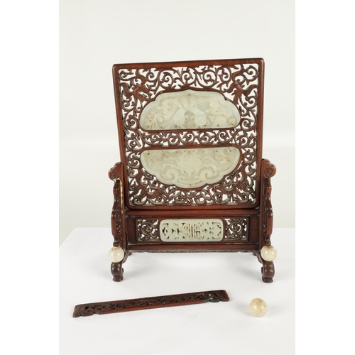 260 - A 19TH CENTURY CHINESE HARDWOOD AND CARVED JADE TABLE SCREEN with finely fret-cut surround having ca... 