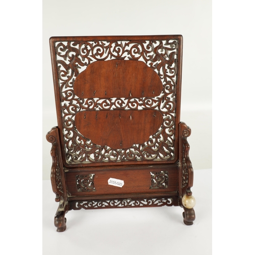 260 - A 19TH CENTURY CHINESE HARDWOOD AND CARVED JADE TABLE SCREEN with finely fret-cut surround having ca... 