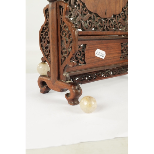 260 - A 19TH CENTURY CHINESE HARDWOOD AND CARVED JADE TABLE SCREEN with finely fret-cut surround having ca... 