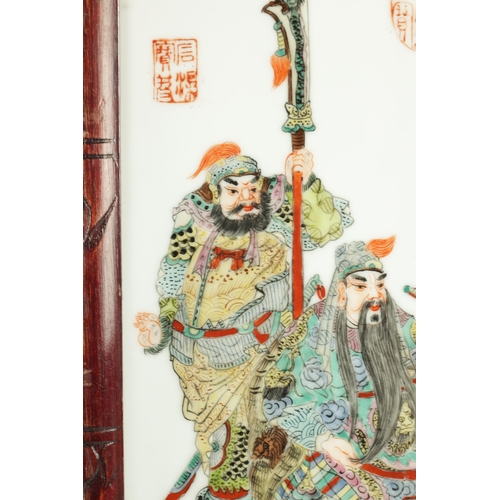 263 - TWO 19TH CENTURY CHINESE PORCELAIN PLAQUES comprising a famille rose plaque depicting figures in a g... 