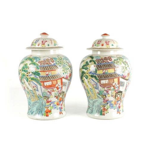 267 - A PAIR OF CHINESE REPUBLIC PORCELAIN VASES AND COVERS decorated wit brightly coloured figural scenes... 